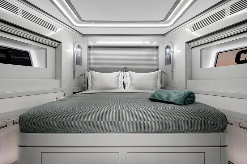  Yacht Photos Pics Luxurious 2024 Sirena 68 yacht bedroom with modern design and elegant lighting.