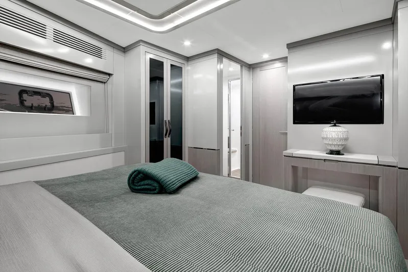 Yacht Photos Pics Luxurious 2024 Sirena 68 yacht bedroom with modern decor and elegant furnishings.