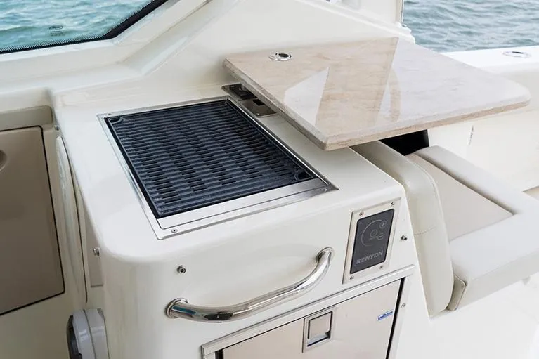  Yacht Photos Pics Manufacturer Provided Image: 2025 Boston Whaler 280 Vantage boat interior with grill and countertop.