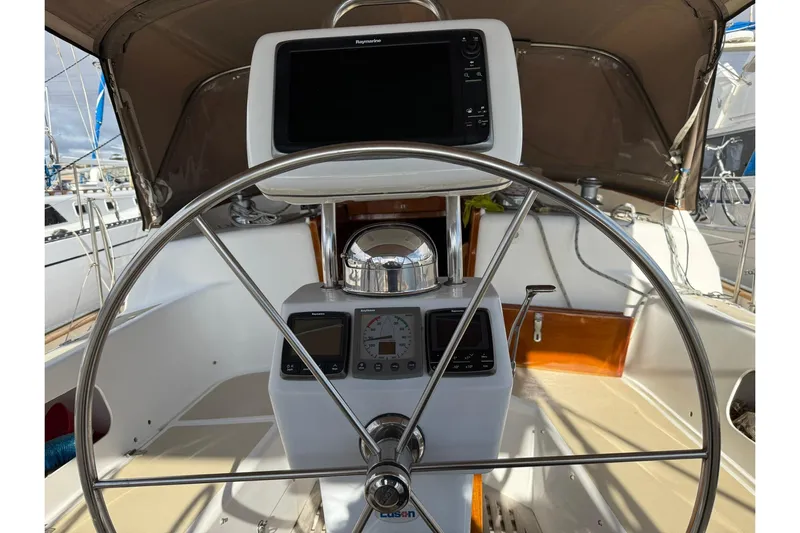 Sarah Yacht Photos Pics Steering wheel and navigation equipment on a 2000 Cabo Rico Cutter 45 sailboat.