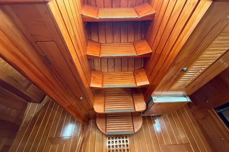 Sarah Yacht Photos Pics Wooden interior stairs of a 2000 Cabo Rico Cutter 45 sailboat.