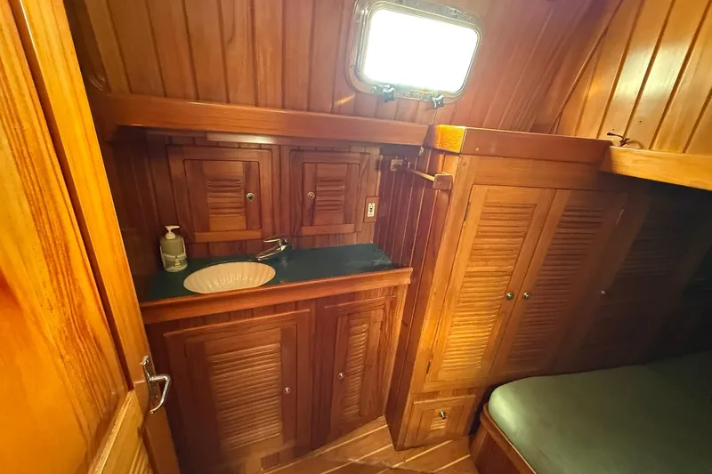 Sarah Yacht Photos Pics Luxurious wooden interior of 2000 Cabo Rico Cutter 45 yacht bathroom.