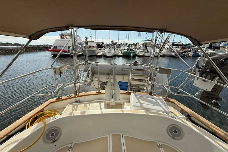 Sarah Yacht Photos Pics Cabo Rico Cutter 45 sailboat, 2000 model, docked in a marina with other boats.