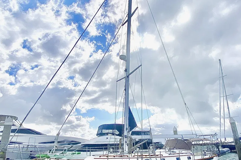 Sarah Yacht Photos Pics Cabo Rico Cutter 45 sailboat from 2000 docked under cloudy sky.