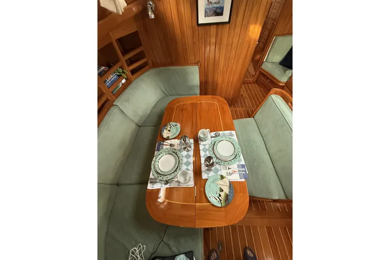 Sarah Yacht Photos Pics Cabo Rico Cutter 45 (2000) interior dining area with elegant table setting.