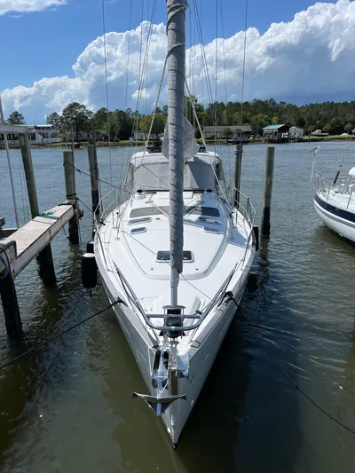  Yacht Photos Pics 2007 Beneteau 423 sailboat docked, front view, with clear skies and calm water.
