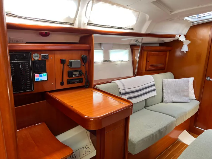  Yacht Photos Pics Interior of 2007 Beneteau 423 sailboat with cozy seating and navigation station.