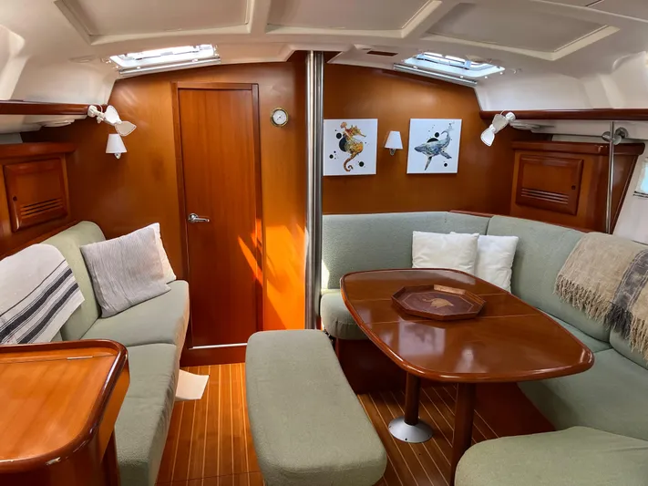 Yacht Photos Pics Luxurious interior of 2007 Beneteau 423 yacht with elegant wood finish and comfortable seating.