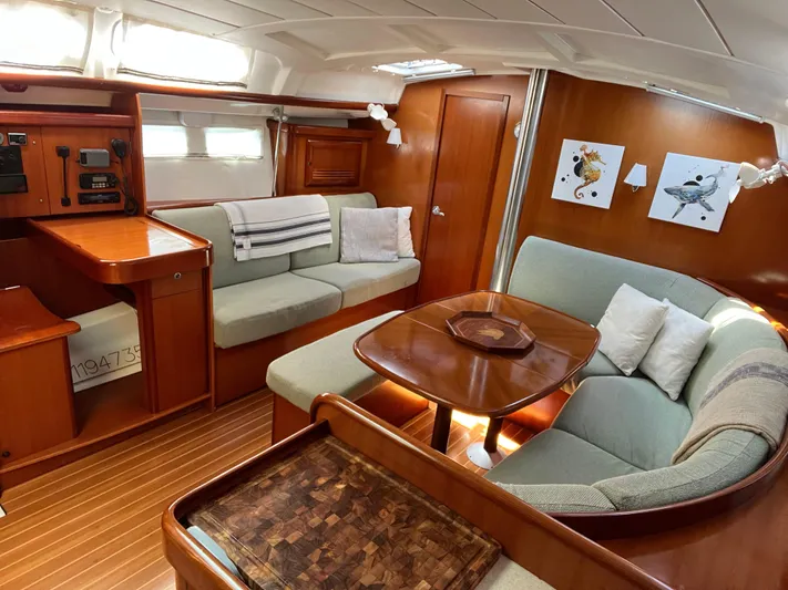  Yacht Photos Pics Luxurious interior of 2007 Beneteau 423 yacht with elegant wood finish and comfortable seating.