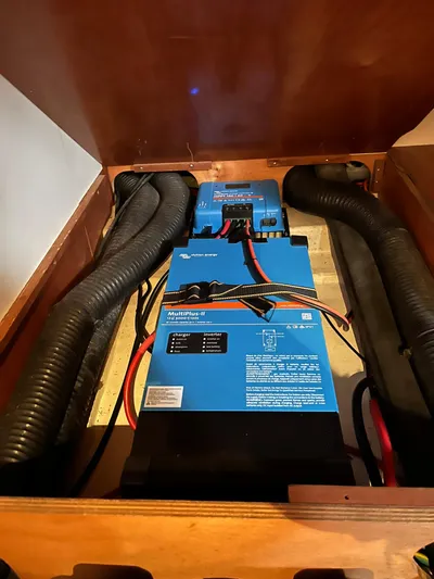  Yacht Photos Pics Electrical system inside a 2007 Beneteau 423 sailboat, featuring blue power inverters.