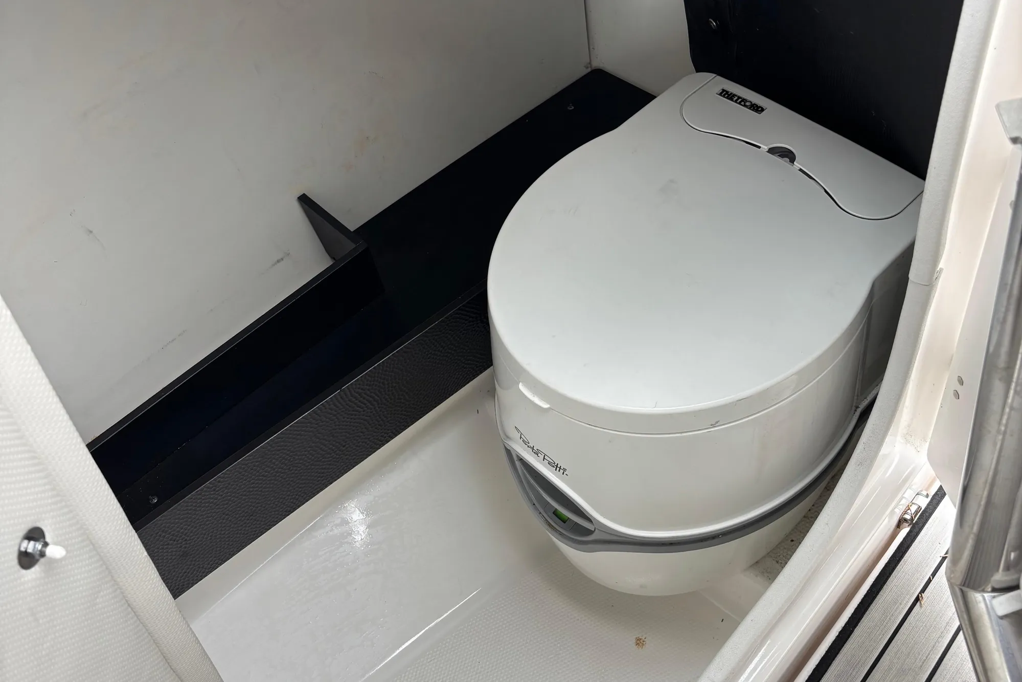 2022 Yamaha Boats 252S interior with compact marine toilet.