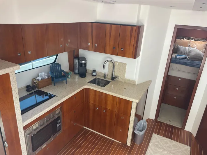Seaquell Yacht Photos Pics Luxurious kitchen interior of 2012 Cruisers Yachts 48 Cantius with modern amenities.