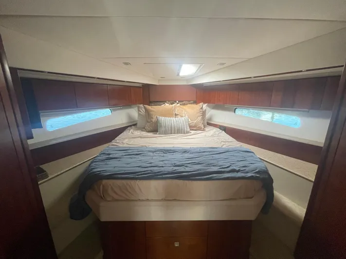 Seaquell Yacht Photos Pics Luxurious bedroom interior of 2012 Cruisers Yachts 48 Cantius with cozy bedding.