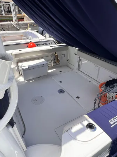  Yacht Photos Pics 2016 Boston Whaler 315 Conquest boat interior with seating and storage.
