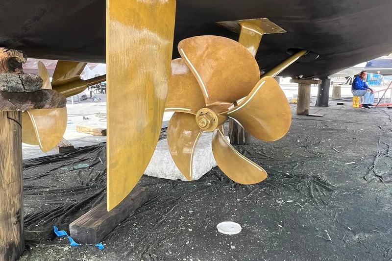 Salty Cowboy Yacht Photos Pics Propeller and rudder of 2022 Princess 55 Flybridge yacht in dry dock.