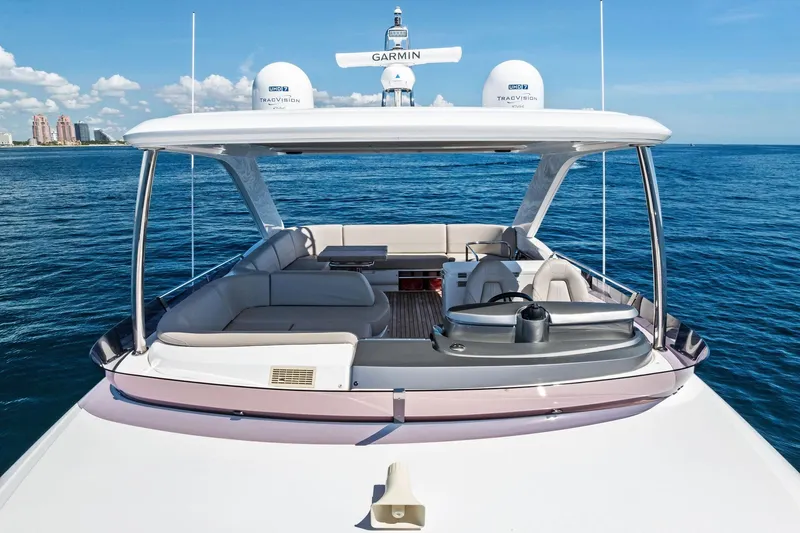 Salty Cowboy Yacht Photos Pics 2022 Princess 55 Flybridge yacht on open sea, featuring spacious seating and modern design.
