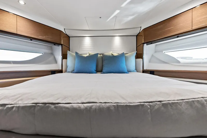 Salty Cowboy Yacht Photos Pics Luxurious bedroom interior of 2022 Princess 55 Flybridge yacht with modern design.