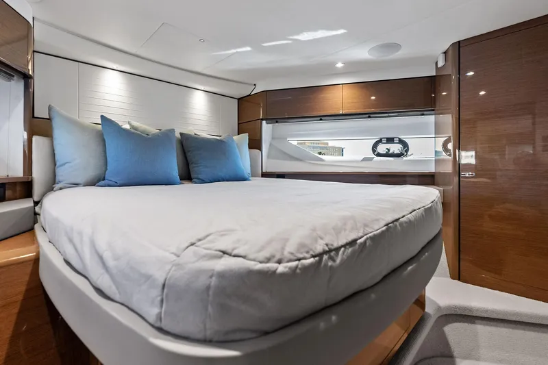 Salty Cowboy Yacht Photos Pics Luxurious bedroom interior of 2022 Princess 55 Flybridge yacht with modern design.