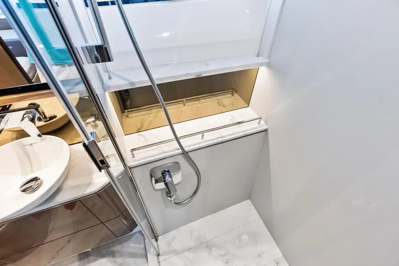 Salty Cowboy Yacht Photos Pics Luxurious bathroom interior on 2022 Princess 55 Flybridge yacht, featuring modern fixtures and elegant design.