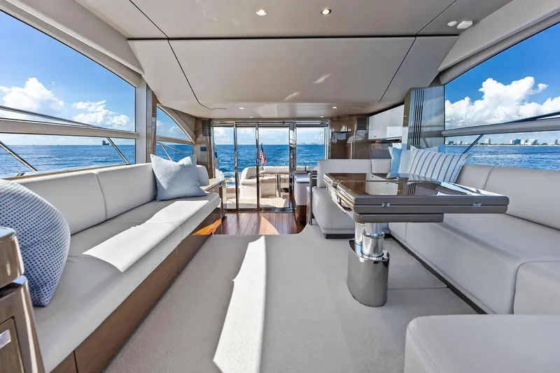 Salty Cowboy Yacht Photos Pics Luxurious interior of 2022 Princess 55 Flybridge yacht with ocean view.