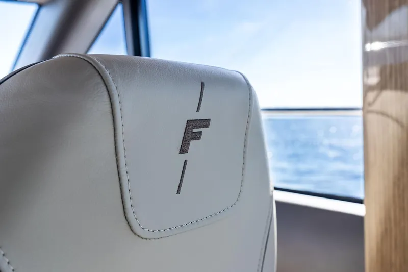 Salty Cowboy Yacht Photos Pics Luxurious interior of 2022 Princess 55 Flybridge yacht with ocean view.