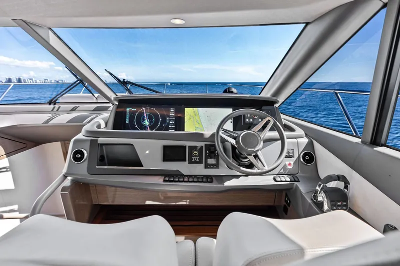 Salty Cowboy Yacht Photos Pics Modern helm of 2022 Princess 55 Flybridge yacht with ocean view.
