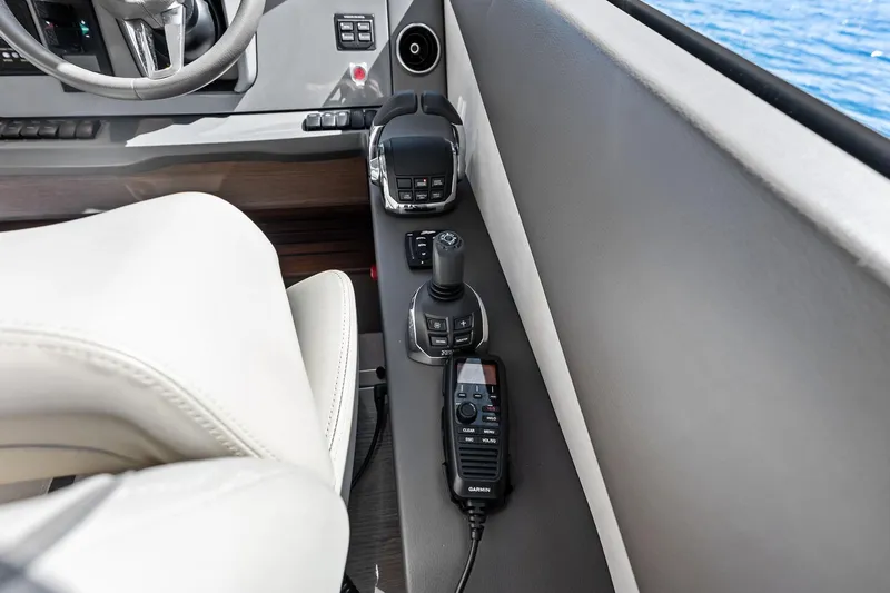 Salty Cowboy Yacht Photos Pics Control panel of 2022 Princess 55 Flybridge yacht with joystick and radio.