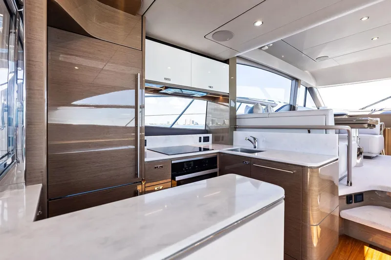 Salty Cowboy Yacht Photos Pics Luxurious kitchen interior of 2022 Princess 55 Flybridge yacht with modern design elements.