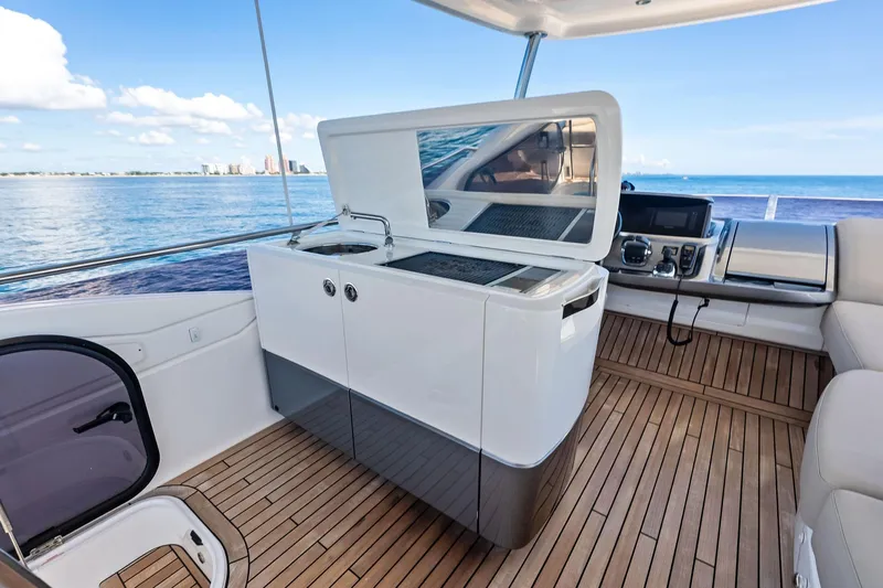 Salty Cowboy Yacht Photos Pics Luxurious 2022 Princess 55 flybridge yacht interior with modern amenities and ocean view.