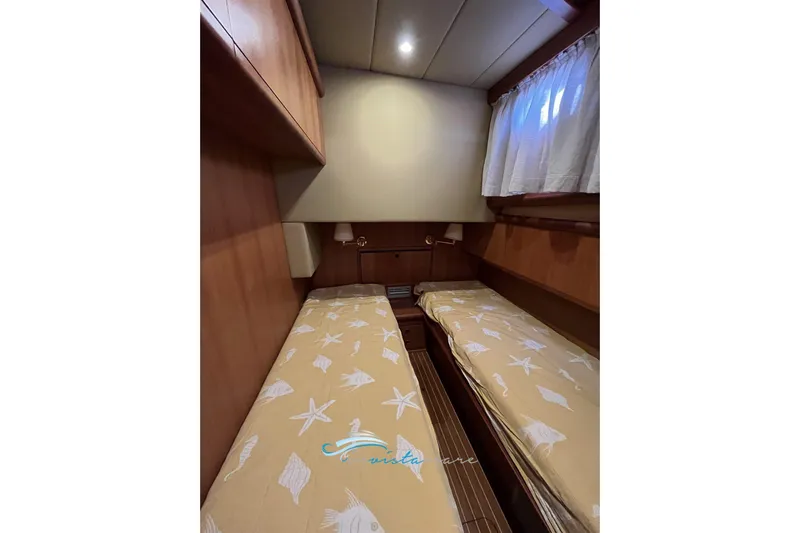  Yacht Photos Pics 2004 Cantieri Estensi GOLDSTAR 440 FLY cabin with twin beds and wooden interior.
