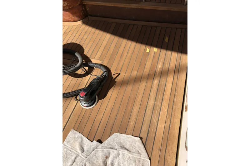  Yacht Photos Pics Teak deck maintenance on 2004 Cantieri Estensi GOLDSTAR 440 FLY yacht.