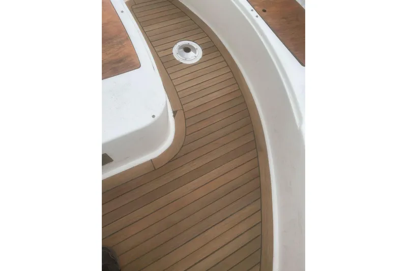 Yacht Photos Pics Teak deck of 2004 Cantieri Estensi GOLDSTAR 440 FLY yacht, showcasing elegant wood finish.