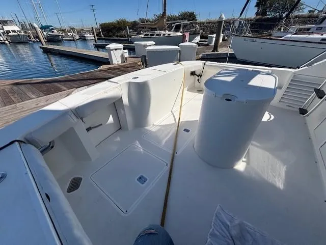  Yacht Photos Pics 2007 Jersey Cape 44 CNV boat docked at marina, showcasing spacious deck layout.