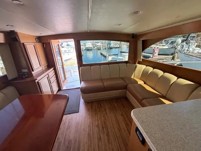  Yacht Photos Pics Luxurious interior of 2007 Jersey Cape 44 CNV yacht with spacious seating and marina view.