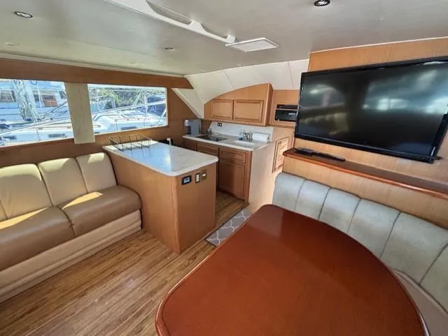  Yacht Photos Pics Luxurious interior of 2007 Jersey Cape 44 CNV yacht with modern amenities and elegant design.