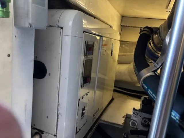  Yacht Photos Pics Engine room of a 2007 Jersey Cape 44 CNV boat, featuring mechanical components.