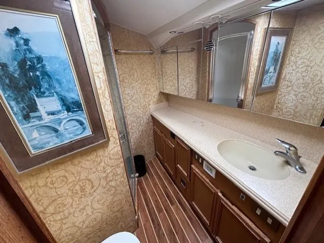  Yacht Photos Pics Luxurious bathroom interior of 2007 Jersey Cape 44 CNV yacht with elegant decor and fixtures.