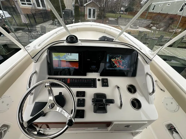 The Bounty Yacht Photos Pics 2017 Pursuit S 280 Center Console helm with electronics.