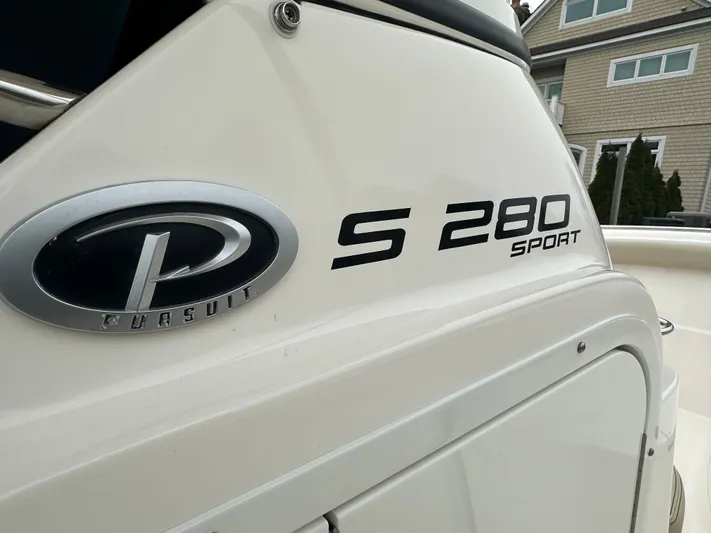 The Bounty Yacht Photos Pics Close-up of Pursuit S 280 Sport boat logo, 2017 model.