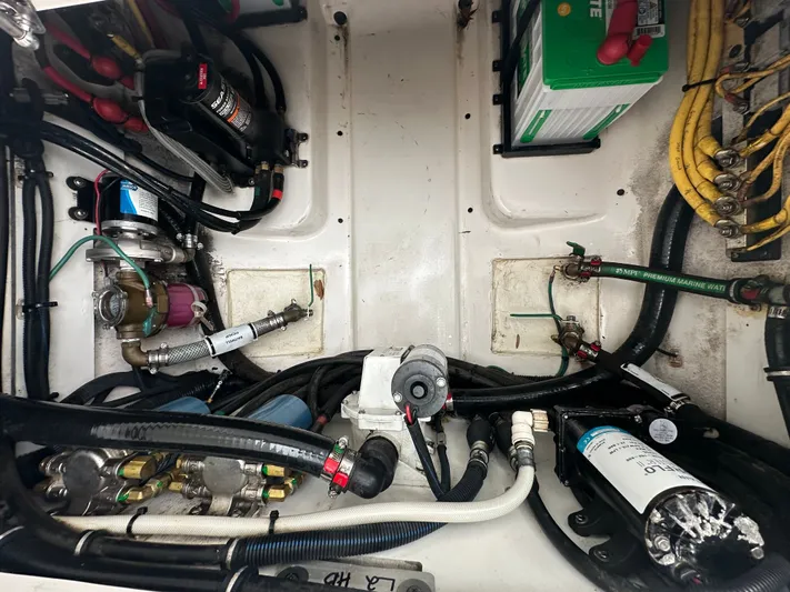 The Bounty Yacht Photos Pics 2017 Pursuit S 280 Center Console engine compartment with wiring and components.
