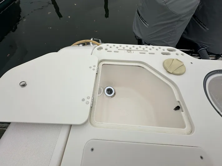 The Bounty Yacht Photos Pics Open storage compartment on a 2017 Pursuit S 280 Center Console boat.