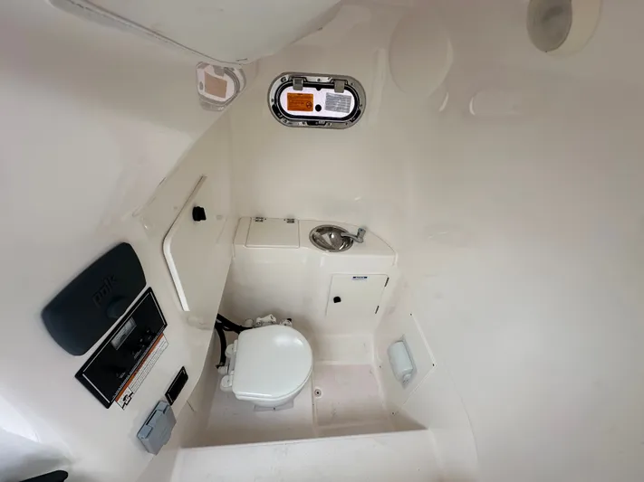 The Bounty Yacht Photos Pics Interior of 2017 Pursuit S 280 Center Console with toilet and sink.