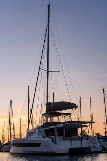 Blureverie Yacht Photos Pics Sailing catamaran Bali 4.8, 2021 model, docked at sunset with masts silhouetted.