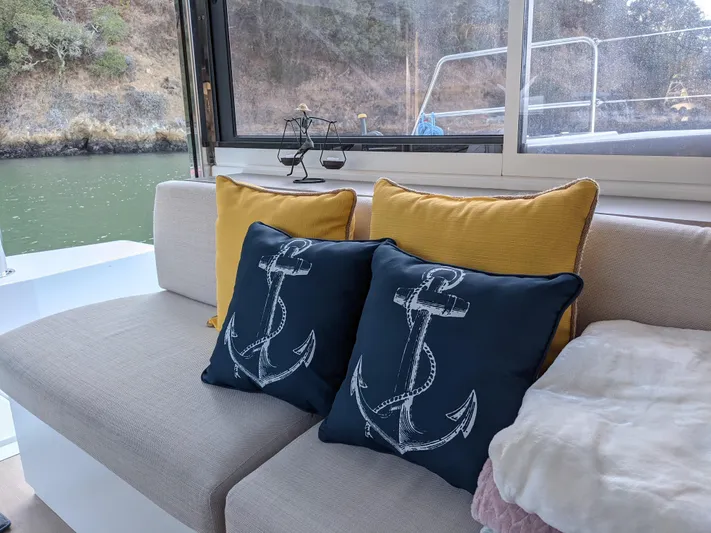 Blureverie Yacht Photos Pics Cozy boat interior with anchor-themed pillows on a Bali 4.8, 2021 model.