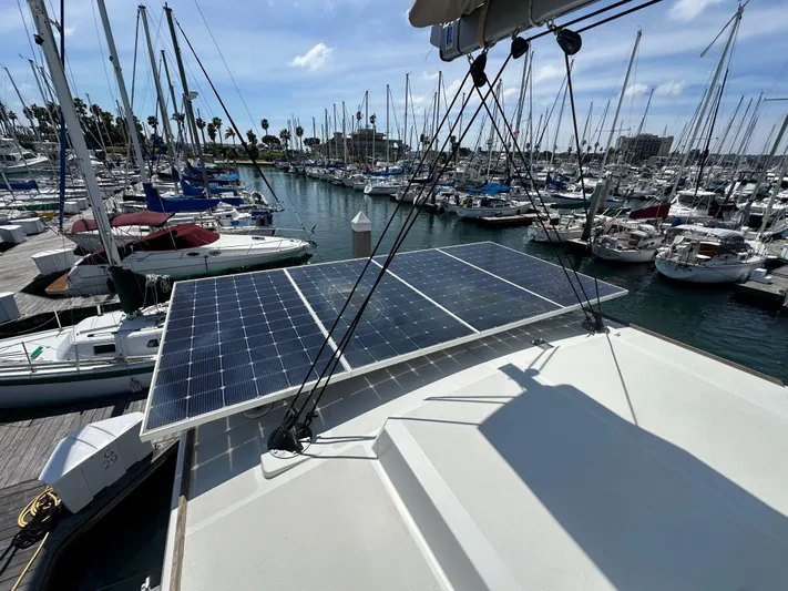 Blureverie Yacht Photos Pics Solar panels on a 2021 Bali 4.8 yacht docked at a marina.