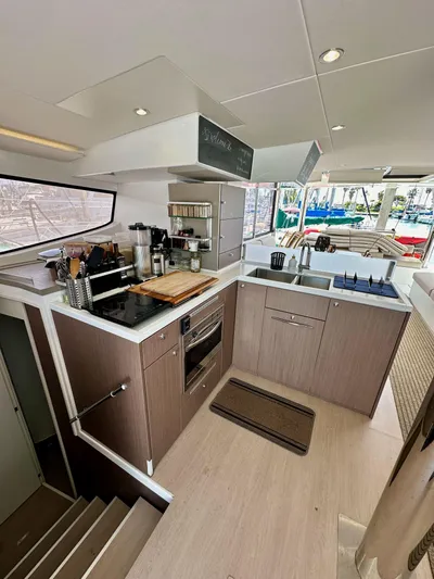 Blureverie Yacht Photos Pics Modern kitchen interior on a 2021 Bali 4.8 yacht, featuring sleek cabinetry and appliances.