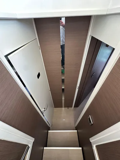 Blureverie Yacht Photos Pics Interior view of a 2021 Bali 4.8 yacht, featuring a narrow hallway and modern design.