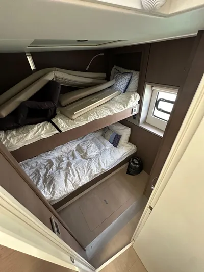 Blureverie Yacht Photos Pics Interior of 2021 Bali 4.8 yacht with bunk beds and window.