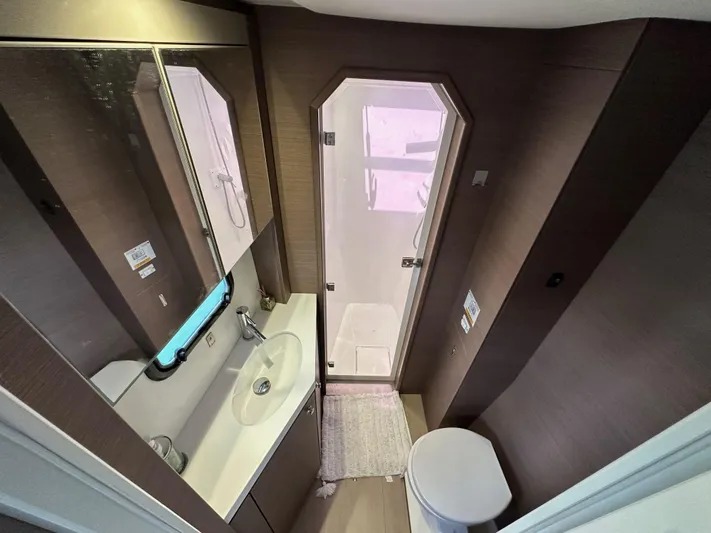 Blureverie Yacht Photos Pics Modern bathroom in 2021 Bali 4.8 yacht with shower, sink, and toilet.