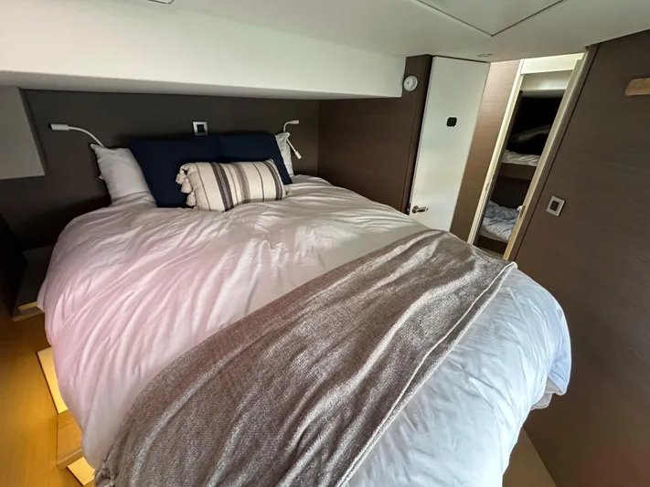 Blureverie Yacht Photos Pics Luxurious bedroom interior in a 2021 Bali 4.8 yacht, featuring a cozy bed and modern design.